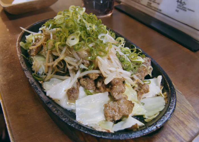 Kagoshima pork fried ramen at Kagoshima Yocky, featuring stir-fried meat and vegetables.